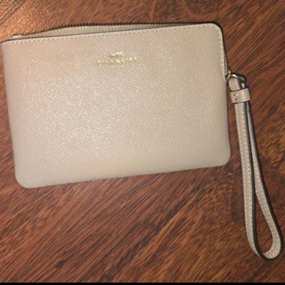 Coach wristlet. Never used, still has original tags. tan